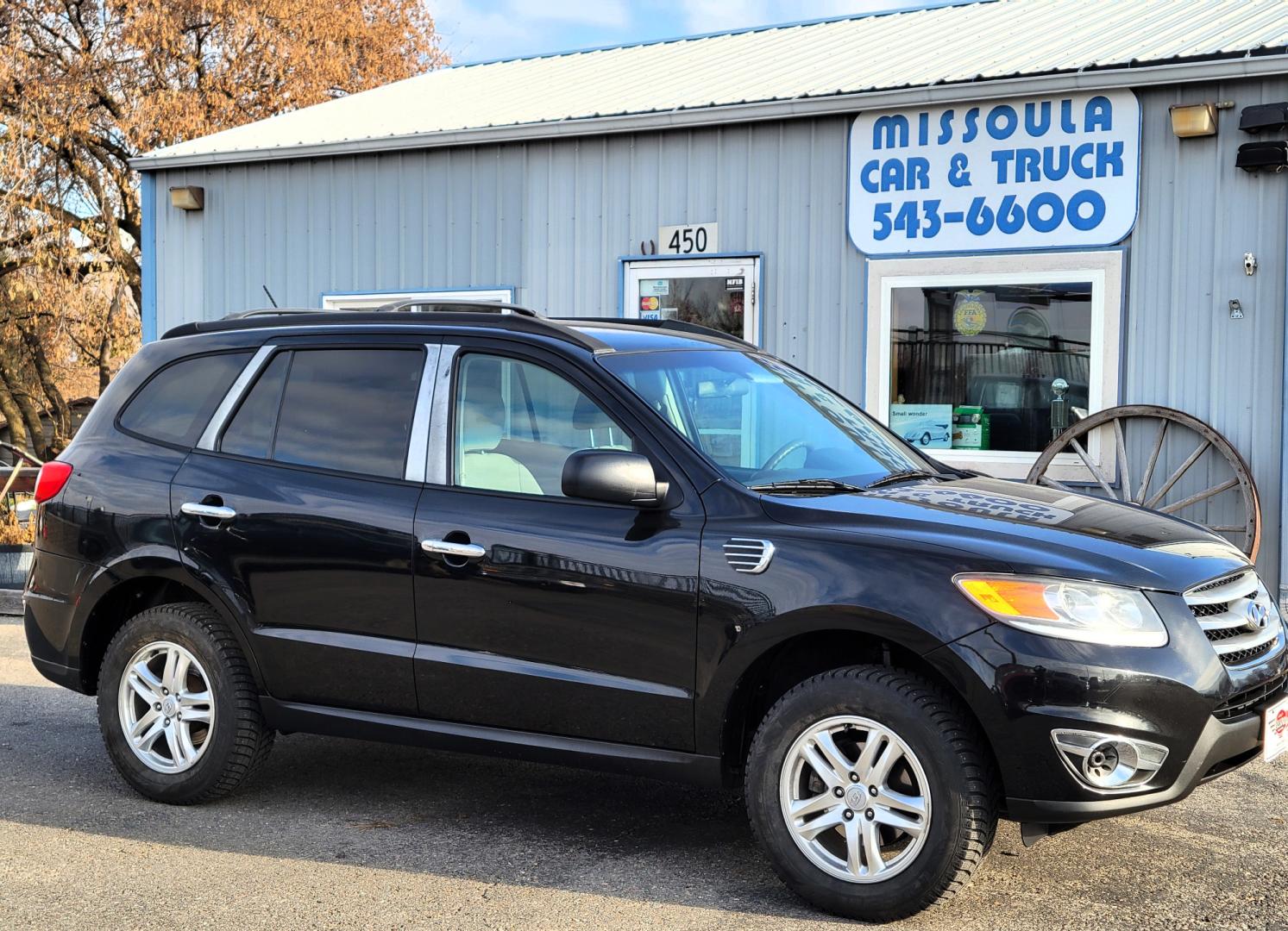 2012 Black /Tan Hyundai Santa Fe Premium (5XYZGDAB1CG) with an 2.4L I4 engine, 8 Speed Automatic transmission, located at 450 N Russell, Missoula, MT, 59801, (406) 543-6600, 46.874496, -114.017433 - NICE AWD SUV. Automatic Transmission. Air. Cruise. Tilt. Power Windows and Locks. AM FM XM Cd Player. Bluetooth. Two Sets of Tires. Studded Snow Tires are currently on. - Photo#0